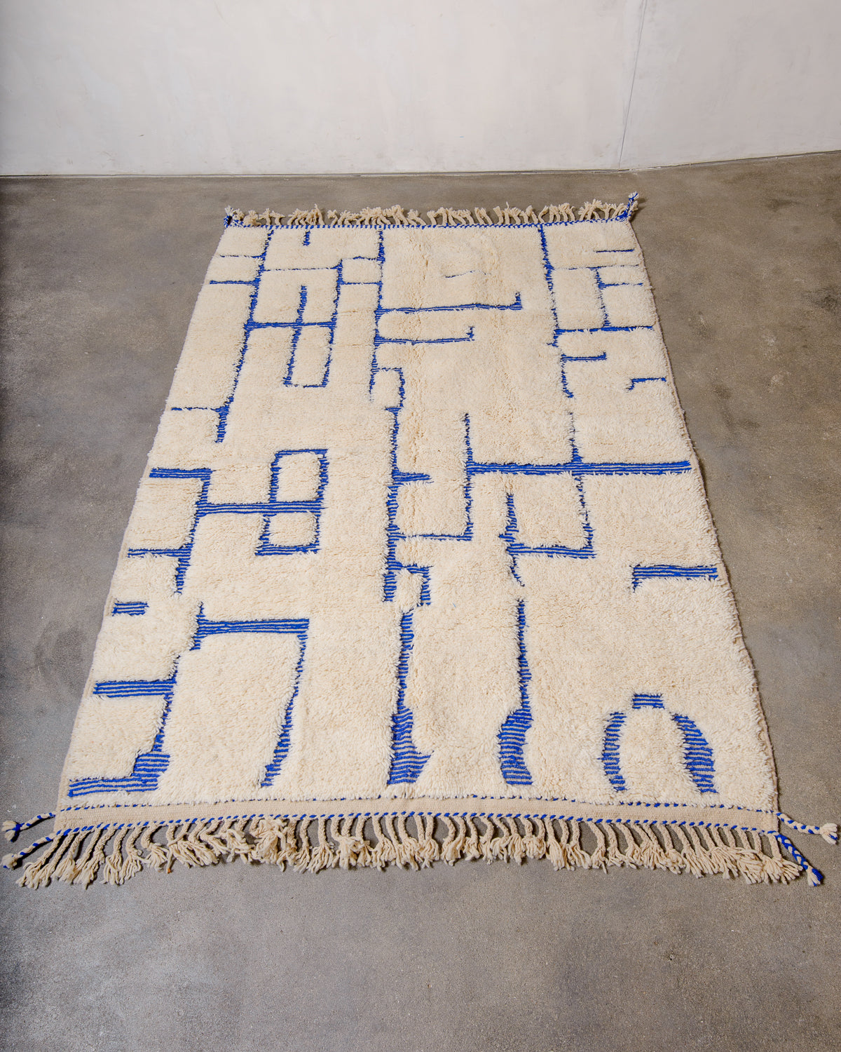 Modern, designer, handcrafted Berber rug from Morocco. Beniourain carpet with minimalist design, natural wool pile and a fluffy texture.